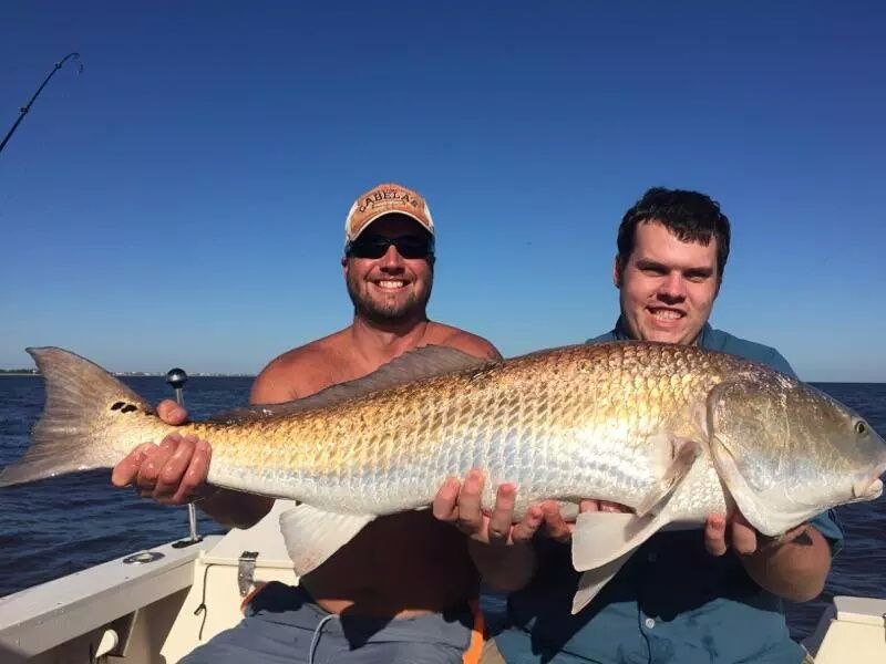 Tim with a bull redfish offshore